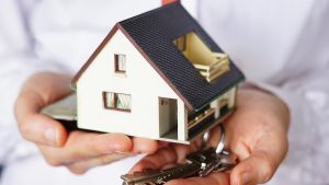 Closeup shot of a person thinking of buying or selling a house